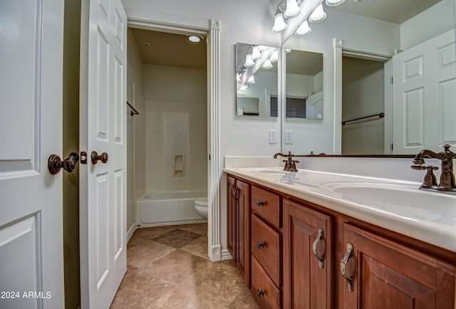 full bathroom with tub / shower combination, dual bowl vanity, toilet, and tile floors