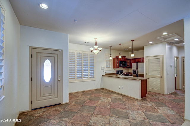 entryway featuring sink, a chandelier, and tile floors