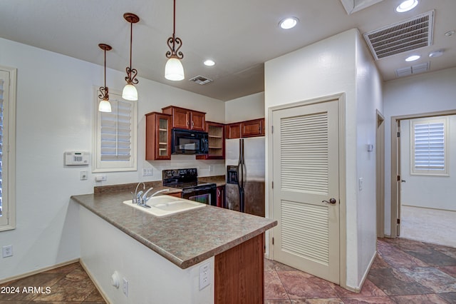 kitchen with kitchen peninsula, tile flooring, black appliances, sink, and pendant lighting