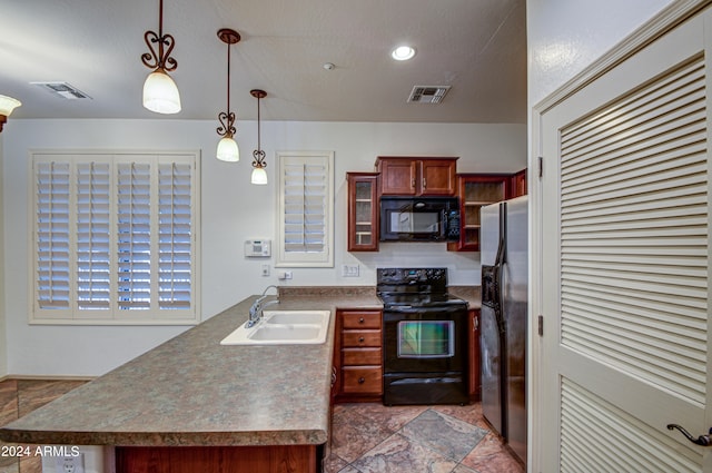 kitchen featuring sink, tile floors, pendant lighting, and black appliances