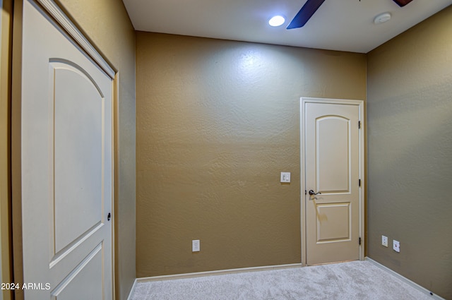 interior space featuring carpet and ceiling fan