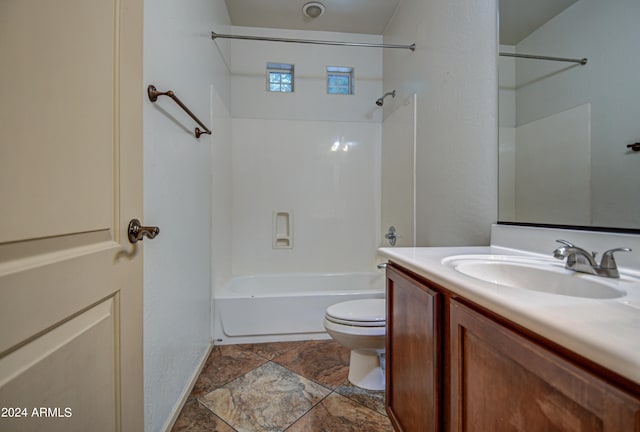 full bathroom with washtub / shower combination, tile floors, toilet, and large vanity