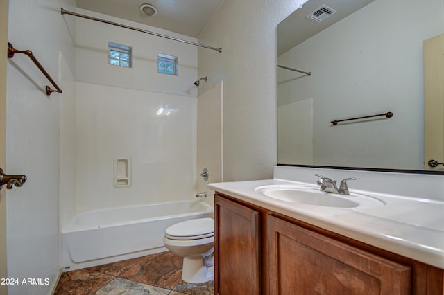 full bathroom featuring vanity, tile floors,  shower combination, and toilet