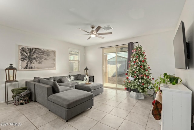 tiled living room featuring ceiling fan