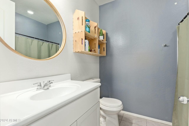 bathroom with tile patterned floors, vanity, and toilet