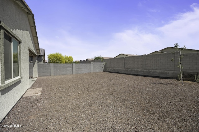 view of yard with a fenced backyard