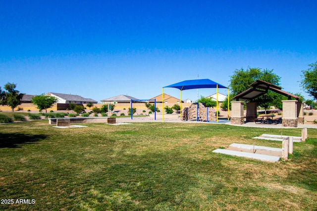 view of yard featuring playground community and a gazebo