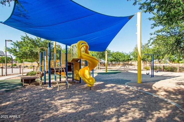 community play area featuring fence