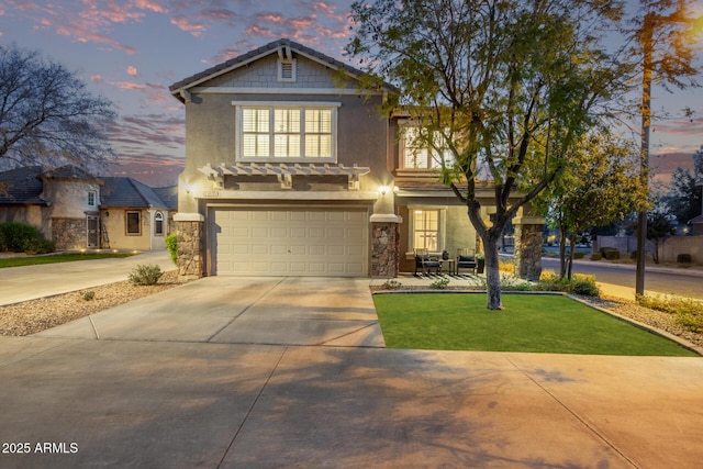 craftsman-style home with a garage and a lawn