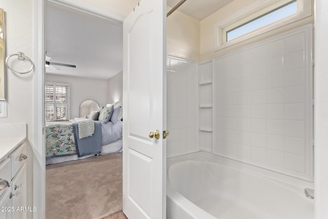 bathroom featuring ceiling fan, shower / tub combination, and vanity