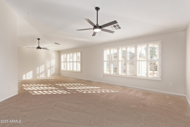 spare room featuring ceiling fan, vaulted ceiling, and carpet