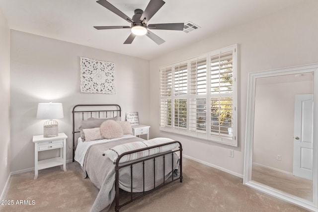 bedroom with ceiling fan and carpet flooring