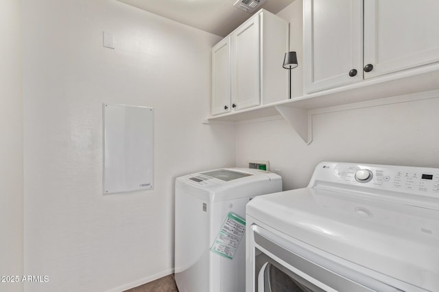 laundry area with cabinets and separate washer and dryer