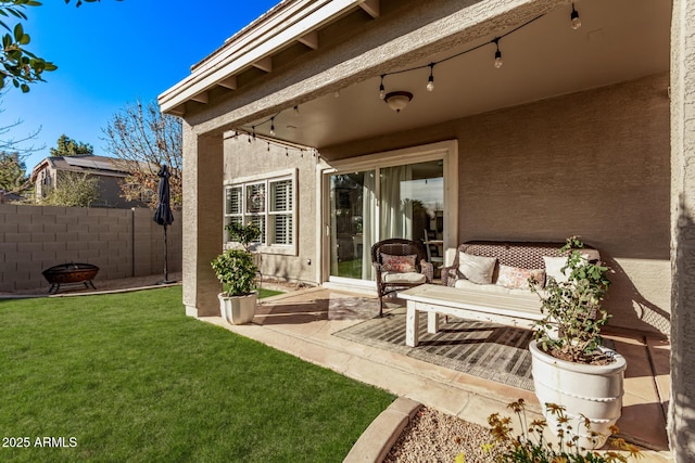 view of patio with a fire pit