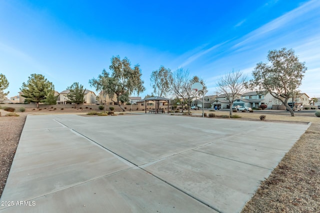 view of property's community with a gazebo and basketball court