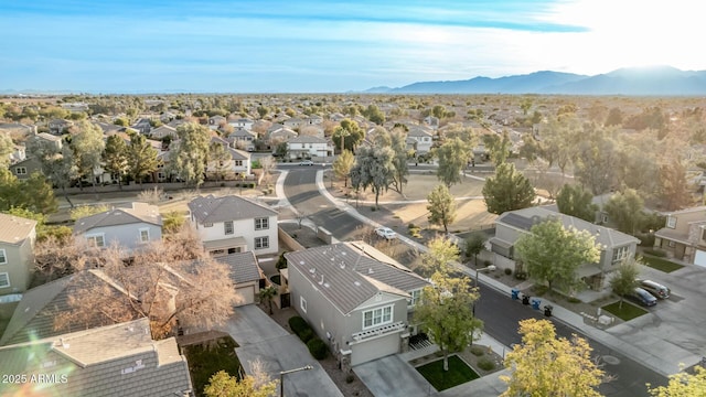 birds eye view of property featuring a mountain view