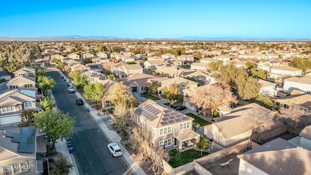 birds eye view of property with a mountain view