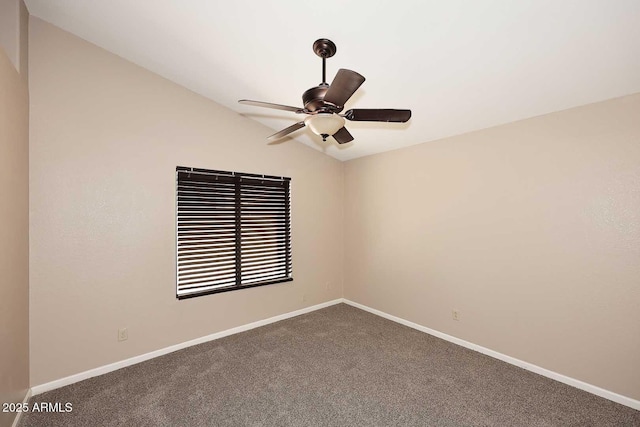 unfurnished room with a ceiling fan, carpet flooring, vaulted ceiling, and baseboards