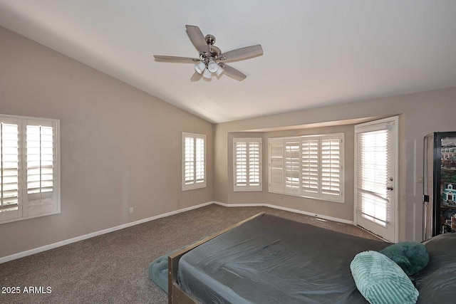 carpeted bedroom featuring access to exterior, vaulted ceiling, baseboards, and ceiling fan