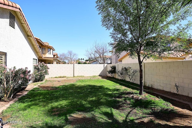 view of yard with a fenced backyard