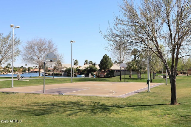 view of sport court with community basketball court and a lawn