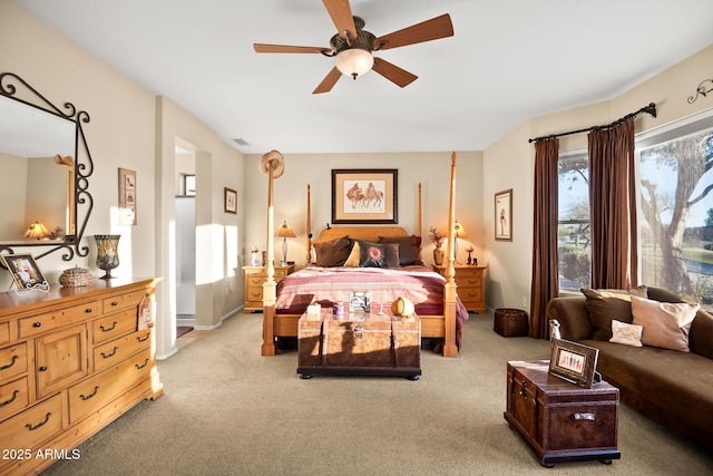 bedroom featuring light carpet, ceiling fan, and visible vents