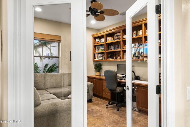 office featuring light tile patterned floors, ceiling fan, built in desk, and recessed lighting