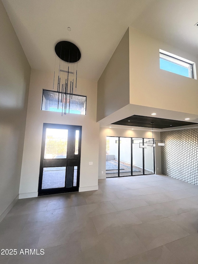 entryway with a towering ceiling