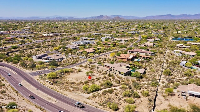 birds eye view of property featuring a mountain view