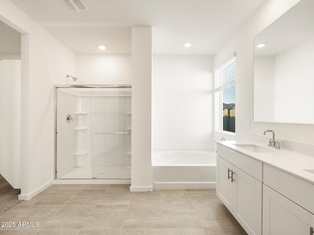 bathroom with vanity and plus walk in shower