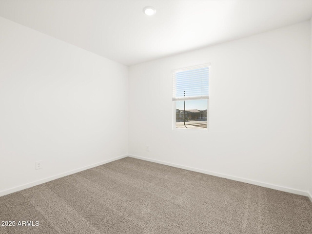 empty room featuring carpet flooring