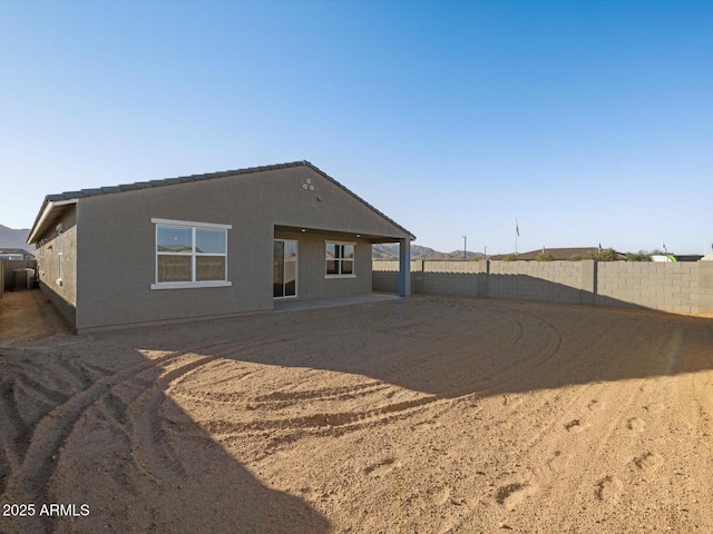 rear view of house featuring a patio area