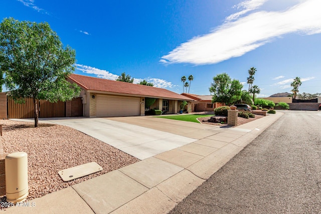 410 E Beck Ln, Phoenix, AZ 85022 - ranch-style home featuring an attached garage, driveway, a tile roof, and stucco siding