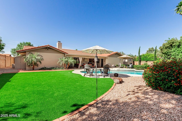 410 E Beck Ln, Phoenix, AZ 85022 - back of property featuring a chimney, a patio area, and stucco siding