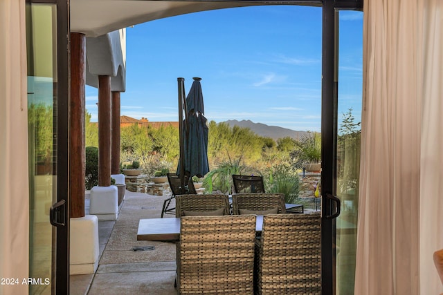 view of patio / terrace with a mountain view