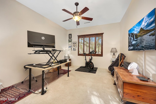 interior space with light carpet, vaulted ceiling, and ceiling fan