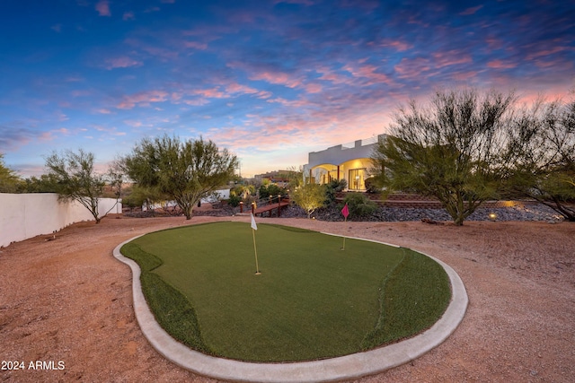 view of yard at dusk