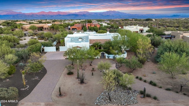 aerial view at dusk with a mountain view