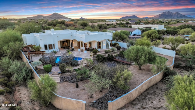 28217 N 139th St, Scottsdale, AZ 85262 - back of house featuring a mountain view, stucco siding, a fenced backyard, and a patio area