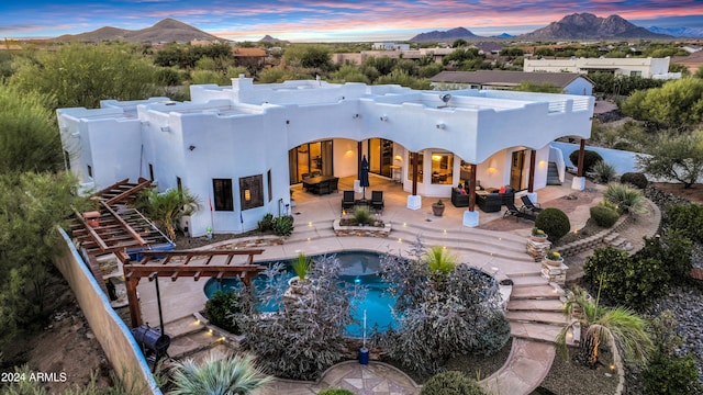 28217 N 139th St, Scottsdale, AZ 85262 - back of house with a mountain view, stucco siding, an outdoor living space, a chimney, and a patio area