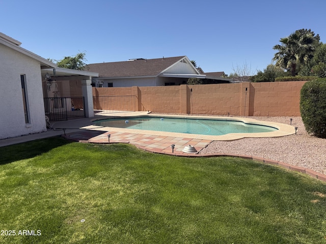 view of pool with a yard, a fenced in pool, and a fenced backyard