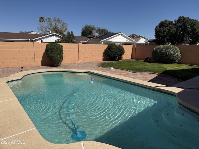 view of pool with a fenced in pool, central AC, and a fenced backyard