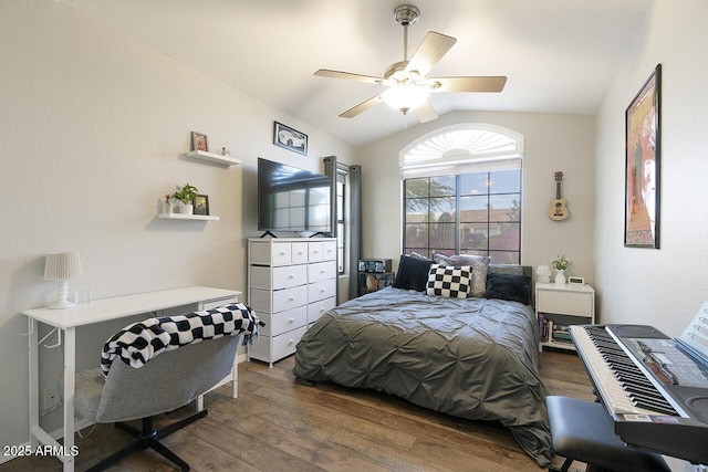 bedroom featuring a ceiling fan, wood finished floors, and lofted ceiling