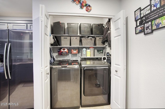 washroom featuring laundry area and washer and dryer