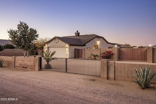 view of front of property with a garage