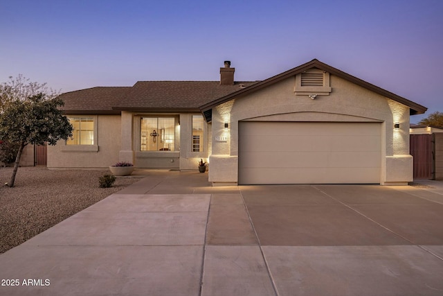 ranch-style house featuring a garage