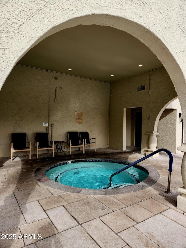 view of swimming pool with a patio area