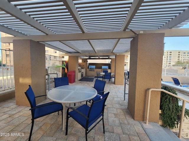 view of patio featuring outdoor dining space and a pergola