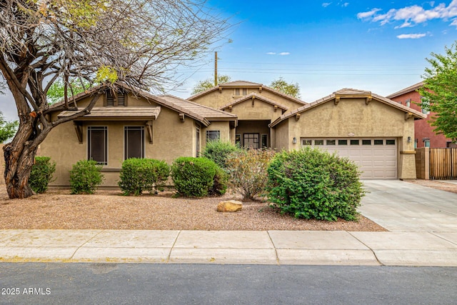 single story home with a tile roof, concrete driveway, stucco siding, and an attached garage