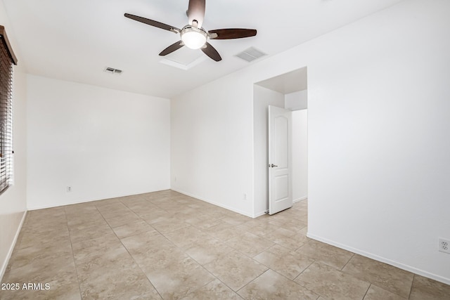 unfurnished room with baseboards, ceiling fan, and visible vents